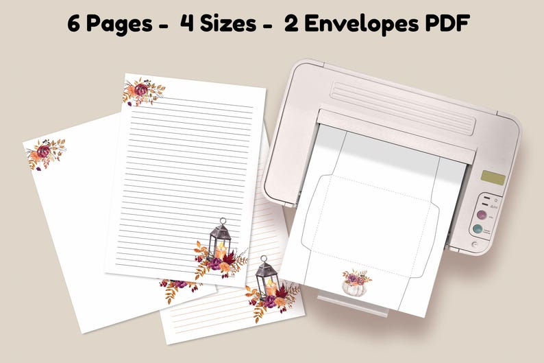 Fall stationery set with lined pages and matching envelopes featuring lantern and floral designs, shown printing from a home printer.