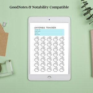 May include: A digital savings tracker on a white tablet with a light blue background. The tracker has a section for saving for, start date, amount, and goal date. There are 49 piggy bank icons with dollar signs on top.