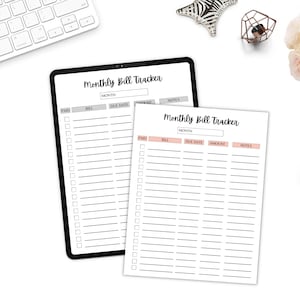 Monthly bill tracker sheets displayed on a white desk with flowers, a gold pen, and a tablet for a clean organized workspace look.