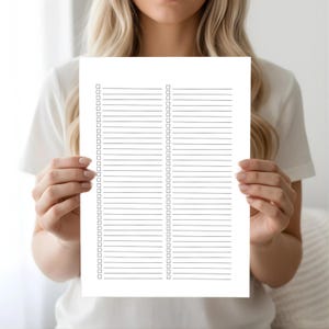 A woman holding a black lined checklist page with two vertical columns of evenly spaced lines and small square checkboxes, shown against a soft neutral background.