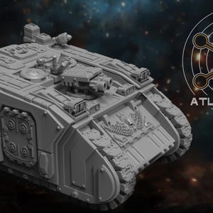 May include: A gray, detailed model of a military tank with multiple turrets and weaponry. The tank has a textured surface and treads. The image includes the text "ATLAN FORGE" and a circular logo.