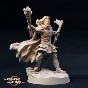 May include: A beige painted miniature figurine of a man with long hair and a beard, wearing a cloak and holding two staffs with flames at the top. The figurine is standing on a rocky base.