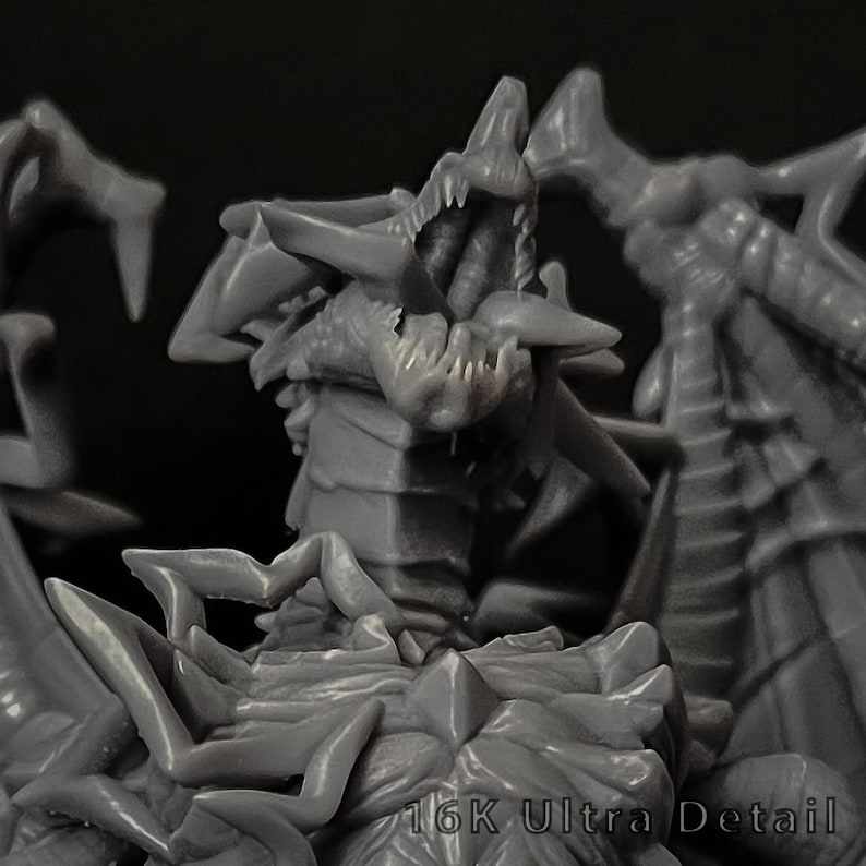 May include: A grey resin miniature figure of a multi-headed dragon with sharp teeth, textured scales, and large wings. The creature features an open mouth and intricate spikes along its body. The text 16K Ultra Detail is visible at the bottom.