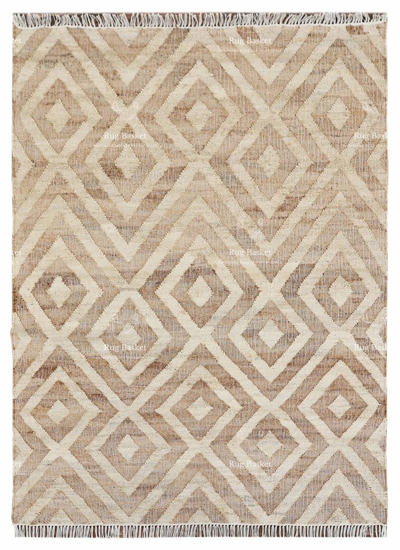 May include: A rectangular beige rug with a geometric diamond pattern. The rug has a woven texture and a fringe border. The diamond pattern is in shades of beige and brown, creating a neutral color palette.