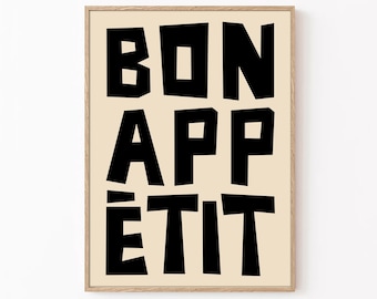 May include: A beige poster with a black frame and the text "BON APPÉTIT" in a bold, blocky font.