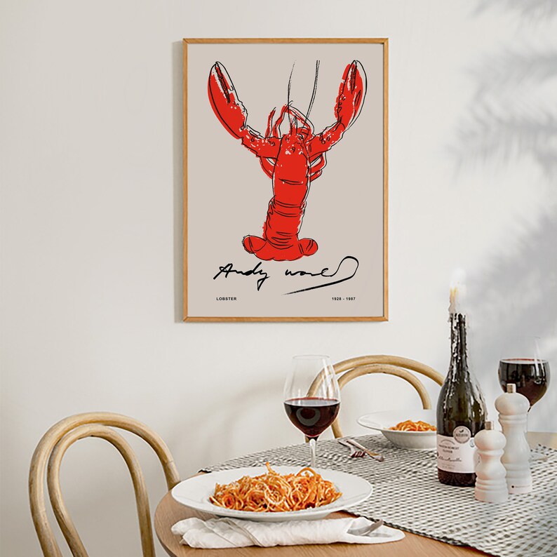 May include: A framed print of a red lobster illustration with the artist's signature "Andy Warhol" and the text "Lobster 1958 - 1987".