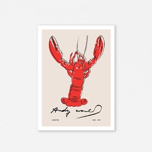 May include: A red lobster illustration with black outlines, signed "Andy Warhol" with the text "LOBSTER 1928 - 1987" below the illustration.