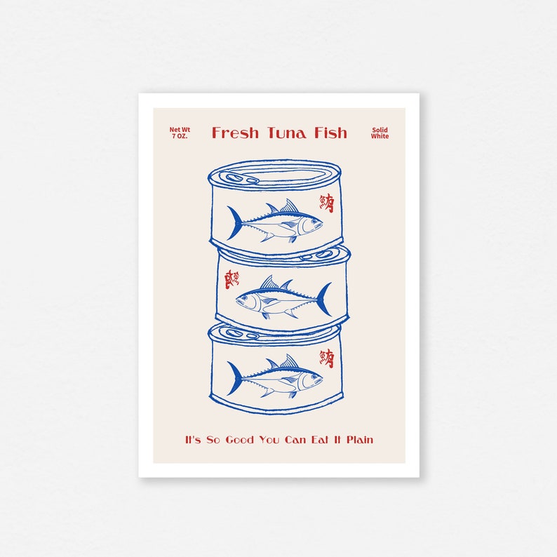May include: A print featuring three stacked tuna fish cans in blue and white. Each can has a tuna fish illustration and Chinese characters. The text "Fresh Tuna Fish" and "It's So Good You Can Eat It Plain" are also included.