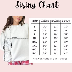 May include: Sizing chart for a sweatshirt with measurements in inches for sizes S through 5XL. The chart shows the width, length, and sleeve length for each size.