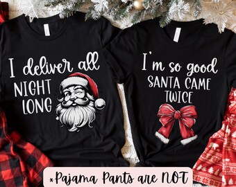 May include: Two black t-shirts with Christmas-themed text and graphics. The first shirt says "I deliver all night long" and features a cartoon Santa Claus. The second shirt says "I'm so good Santa came twice" and features a red bow. The text "*Pajama Pants are NOT included*" is written below the shirts.