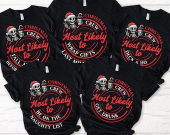 May include: Five black t-shirts with a white skeleton holding a coffee cup and wearing a Santa hat. Each shirt has a red circle with white text that says "Christmas Crew Most Likely to" followed by a different phrase. The phrases are "Fall Asleep Before Dessert", "Wrap Gifts Last Minute", "Deck the Halls", "Be on the Naughty List", and "Get Drunk".