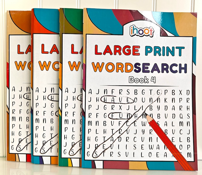 May include: Four "Large Print Wordsearch Book 4" puzzle books are displayed. The covers have colorful designs and the text "Large Print Wordsearch" in orange and teal. A pencil circles words on the open puzzle page.