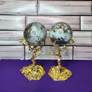 Two Pieces: Snow Agate with Pyrite Crystal Stone Sphere with Tree Holder
