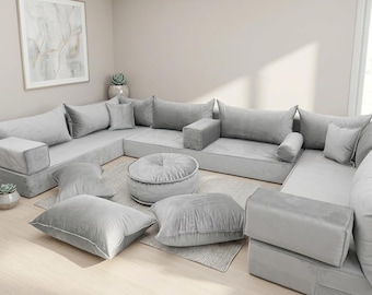 U-vormige grijze vloerbank: traditionele Ottomaanse loungeset met modulaire zitplaatsen