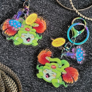 Dusa Keychain Motivational Glitter Charm from Hades Game 2.5 inches wide