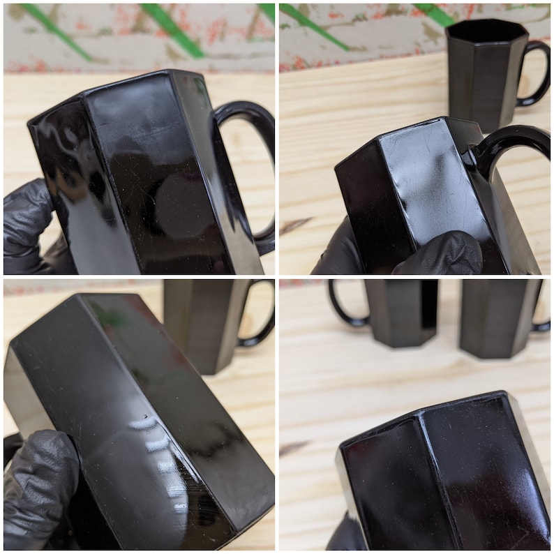May include: Set of four black glass mugs with a hexagonal shape and a handle. The mugs have a glossy finish and are perfect for serving beverages.