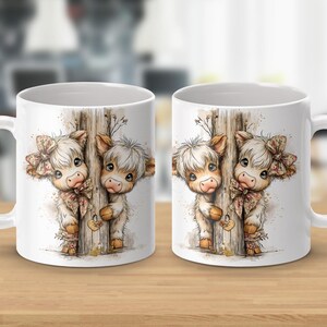 May include: White ceramic coffee mug featuring a watercolor illustration of two adorable Highland cows peeking from behind a wooden post. The cows have fluffy white fur, brown ears, and wear floral bows. A charming gift for cow lovers.