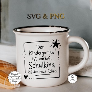 May include: White ceramic mug with a black rim and handle. The mug features black text that reads "Der Kindergarten ist vorbei, Schulkind ist der neue Schrei." A black star and heart are also included in the design. The mug also has the text "SVG & PNG".