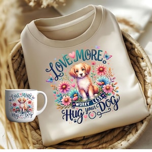 Könnte beinhalten: Ein beiger Pullover mit einem bunten Blumenmuster und einem Golden Retriever-Welpen. Der Text "Love More Worry Less Hug Your Dog" ist auf dem Pullover aufgedruckt.