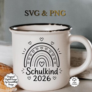 May include: White ceramic mug with a black rim and handle, featuring a black rainbow design with hearts and the text "Schulkind 2026." The mug also has the text "SVG & PNG" at the top.
