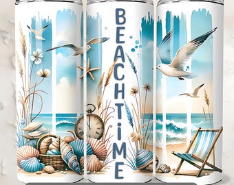 May include: A white tumbler with a blue and white beach scene. The tumbler has the words "Beach Time" written on it. The scene includes seashells, a beach chair, and seagulls.