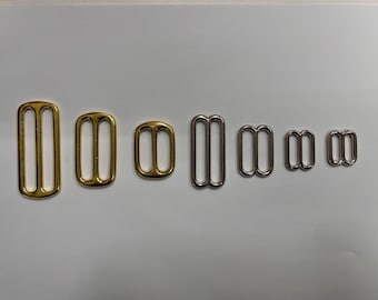 Gold and Nickel Metal Sliders along with welded D-Rings and welded O-Rings for Dog Collars