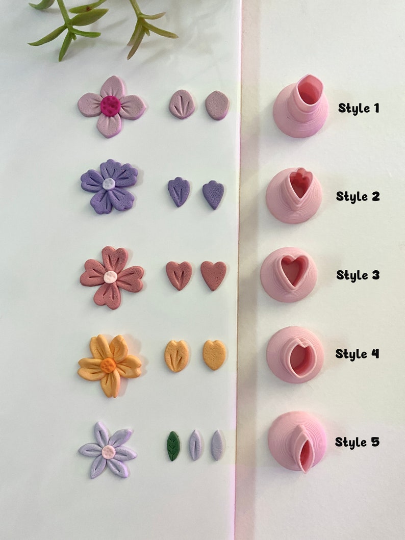 May include: Five different styles of polymer clay earrings with flower and leaf designs. The earrings are displayed on a white surface with the text "Style 1", "Style 2", "Style 3", "Style 4", and "Style 5" next to each style.