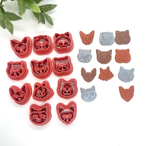 May include: A set of 15 red plastic cat-shaped cookie cutters and 10 grey, brown, and red plastic cat-shaped cookie cutters.