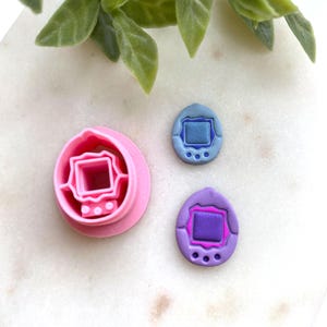 May include: A white ceramic mug with a black handle and the text "But First, Coffee" in a handwritten style. The mug is on a white surface. The mug is approximately 4 inches tall.