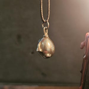 Behelit Pendant Hand Cast Pewter Berserk Necklace Anime Talisman + Cotton Cord Crimson Beherit Replica image 6