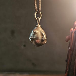 Behelit Pendant Hand Cast Pewter Berserk Necklace Anime Talisman + Cotton Cord Crimson Beherit Replica image 2