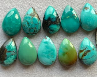 May include: Ten teardrop-shaped turquoise stones in various shades of blue and green. The stones have a smooth, polished finish and are ready to be used in jewelry making.