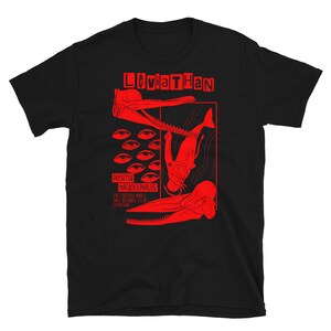 May include: Black t-shirt with a red graphic of a creature with the text "Leviathan" and "Physeter Macrocephalus The toothed whale once referred to as Leviathan".