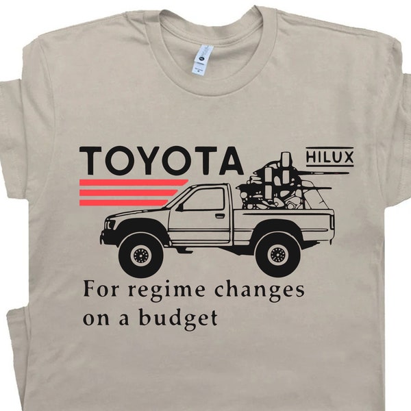 A T-shirt that says "Toyota Hilux for regime changes on a budget" celebrates the legendary pickup truck that can withstand any conflict