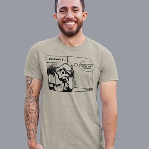 May include: A light gray t-shirt with a black and white comic strip graphic of a Stormtrooper saying "Maybe those were the droids". The comic strip is titled "Meanwhile..."