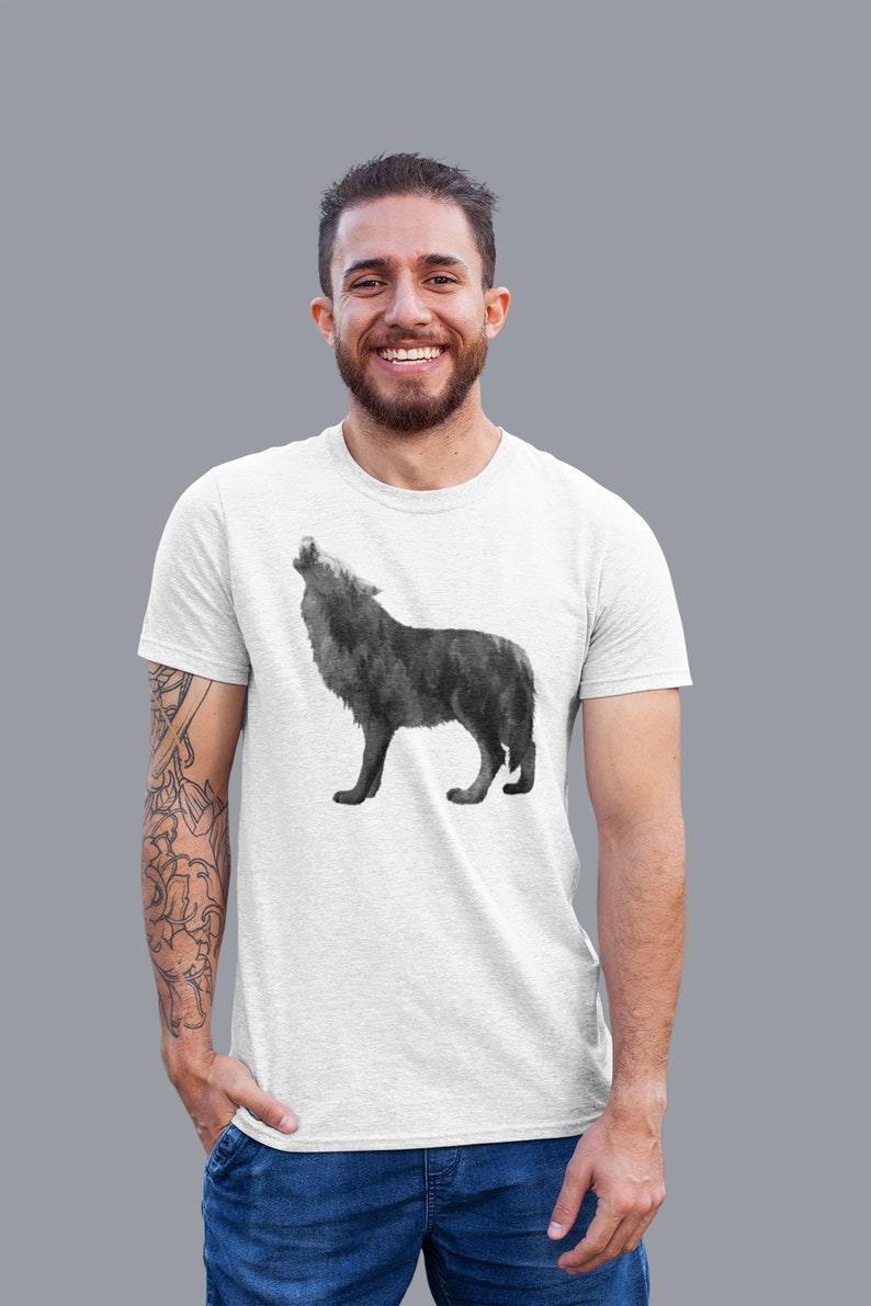 May include: A white t-shirt with a black and white watercolor wolf howling at the moon graphic.