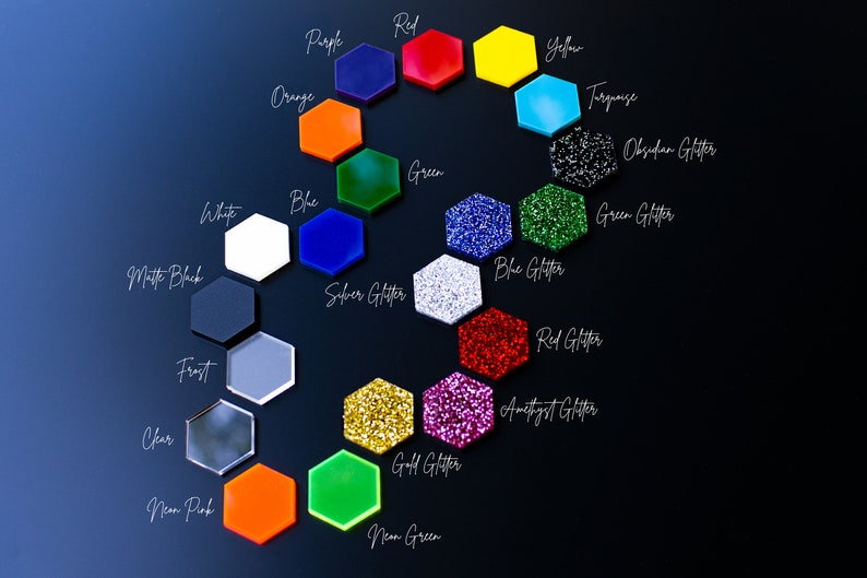 May include: A color chart of 20 different acrylic sheets in hexagon shapes. The colors include red, yellow, blue, green, orange, purple, turquoise, white, black, silver glitter, gold glitter, blue glitter, green glitter, red glitter, amethyst glitter, obsidian glitter, frost, clear, neon pink, and neon green.