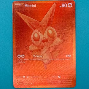 how do you tell if a yugioh card is rare 020/203 - Victini (Reverse Holo) Pokemon Card