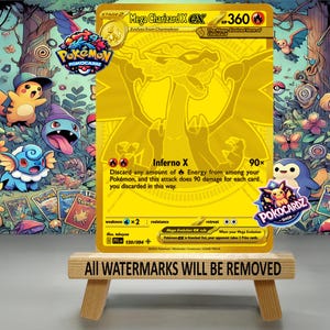 May include: A gold-colored Mega Charizard X EX Pok&eacute;mon card, displayed on a small wooden easel. The card features a Charizard illustration and the text "Inferno X". The background is a colorful illustration of various Pok&eacute;mon characters.
