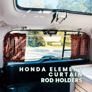 May include: Interior view of a Honda Element with brown checkered curtains and the text "HONDA ELEMENT CURTAIN ROD HOLDERS". The curtains are hanging from the ceiling and frame the rear window. A string of lights is strung across the top.