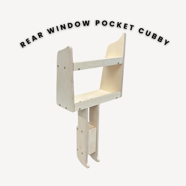 May include: A wooden rear window pocket cubby with two shelves. The cubby is made of plywood and has a light wood finish. It is designed to fit in the rear window of a vehicle.
