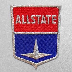 May include: A red and blue embroidered patch with a silver outline. The patch features the word "ALLSTATE" in white lettering and a silver star in the center.
