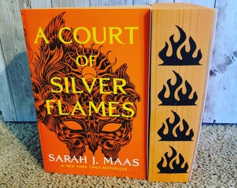 A Court of Silver Flames paperback edition, by Sarah J Maas with custom sprayed edges