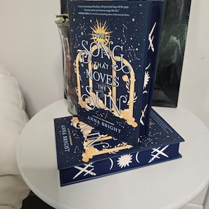 The Song That Moves The Sun hardcover by Anna Bright, with custom sprayed edges!