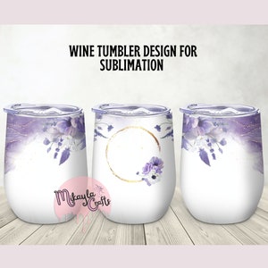 May include: Three stainless steel wine tumblers with a purple and white floral design. The tumbler in the middle has a gold circle with a floral design inside.