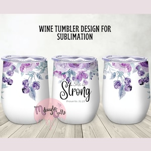 May include: A white wine tumbler with a purple floral design and the text "She is Strong Proverbs 31:25".