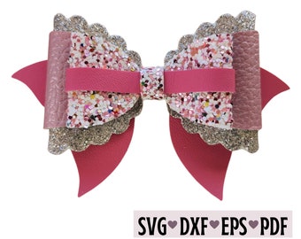 May include: A pink and silver glitter bow with scalloped edges. The bow has a pink center and is layered with silver glitter and pink glitter. The bow is perfect for adding a touch of sparkle to any project.