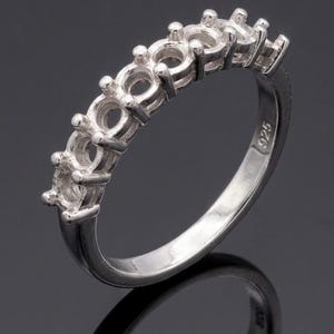 May include: A rustic wooden sign with the text "Welcome to our home" in white lettering. The sign features a distressed finish and a simple, inviting design, perfect for front door decor.