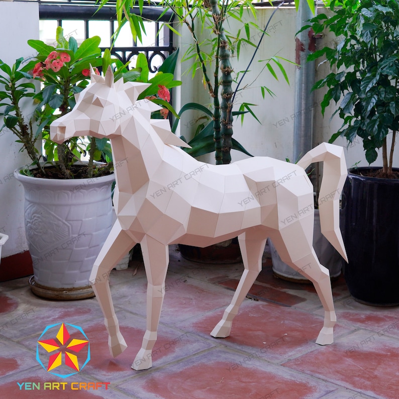 May include: A white papercraft horse sculpture with a geometric design. The horse is standing on a tiled floor with plants in pots in the background.