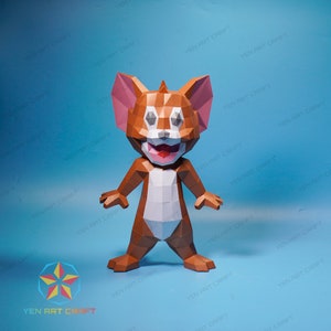 May include: A papercraft model of Tom from the cartoon Tom and Jerry. The model is made of brown, white, and gray paper and is posed standing with a happy expression. The model is on a blue background.